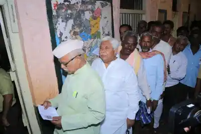 Gadag: Congress leader H. K. Patil waits for his turn to cast his vote for the third phase of 2019 Lok Sabha elections, at a polling station in Karnataka