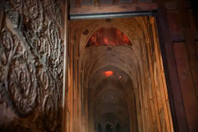 Smoke and flames seen in the interior of the cathedral.
