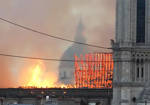Flames rise from Notre Dame cathedral as it burns in Paris.