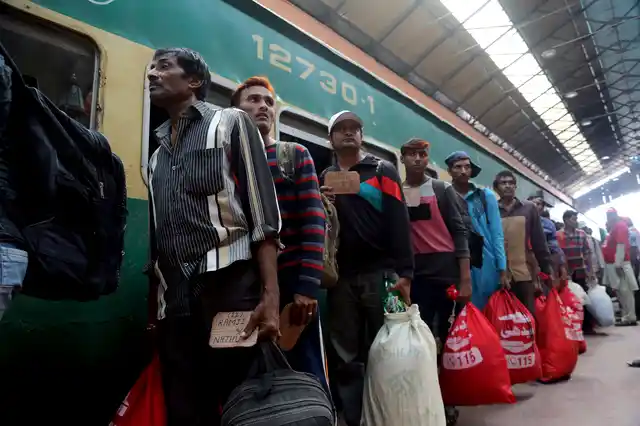 Indian fisherfolk line up to leave for India after being released at Lahore railway station in Pakistan.