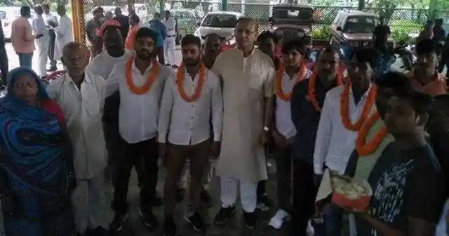 Union Minister Jayant Sinha with men convicted in a case of mob lynching in Jharkhand.
