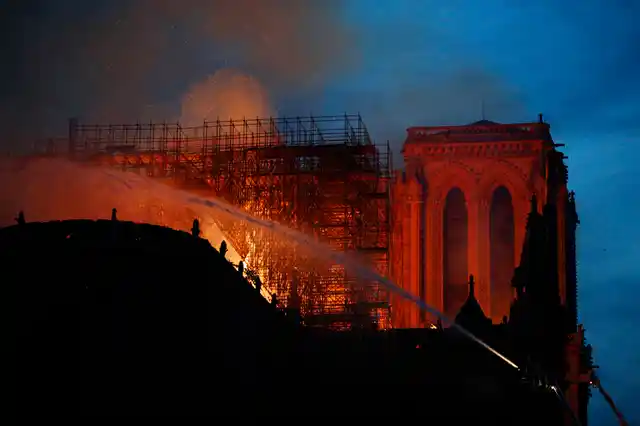 A catastrophic fire engulfed the upper reaches of Paris’ soaring Notre Dame Cathedral as it was undergoing renovations Monday, threatening one of the greatest architectural treasures of the Western world as tourists and Parisians looked on aghast from the streets below.