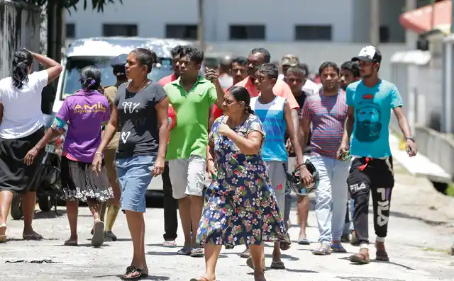 Relatives gather outside a hospital following the blasts in Colombo.