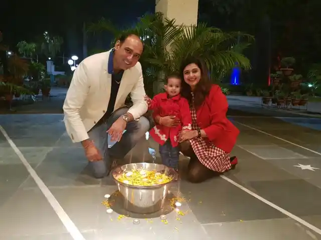 Neha, with her husband Varun Mmonga, and their two-year-old daughter.