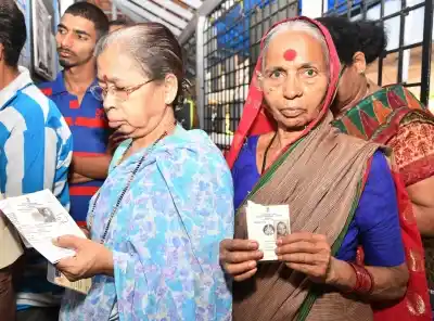 Ribandar (Goa): Women voters wait for their turn to cast their votes for the third phase of 2019 Lok Sabha elections at a polling booth at Sao Pedro in Ribandar, Goa on April 23, 2019. (Photo: IANS/PIB)
