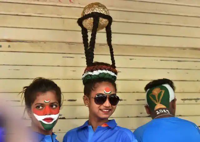 Cricket fans get a haircut done to cheer for team India ahead of the ICC Cricket World Cup 2019, in Mumbai. 