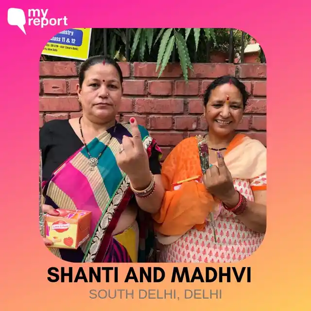 Shanti and Madhvi smile for a picture.
