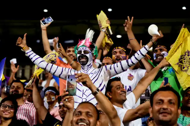 Supporters of Kolkata Knight Riders cheer for their team during the VIVO IPL cricket T20 match against Mumbai Indians in Kolkata, on Sunday, 28 April 2019.
