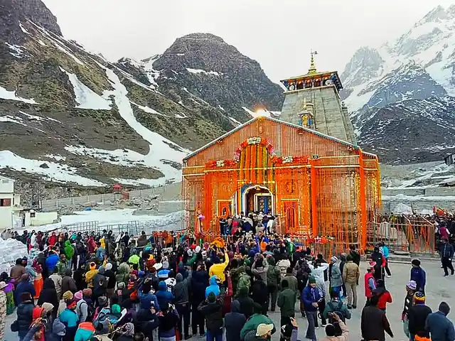 Pilgrims arrive to offer prayers as the portals of Kedarnath temple are opened after the winters, in Kedarnath, on Thursday, 9 May.