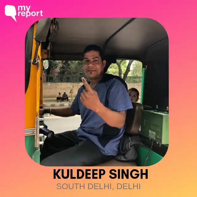 Kuldeep Singh smiles from his auto. 