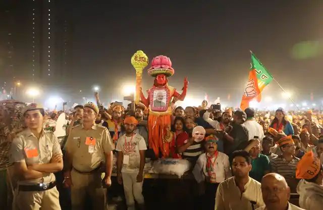 A supporter wears a lotus headgear, the symbol of India’s ruling BJP, during an election campaign rally in New Delhi. The current LS elections are being seen as a referendum on Prime Minister Narendra Modi.