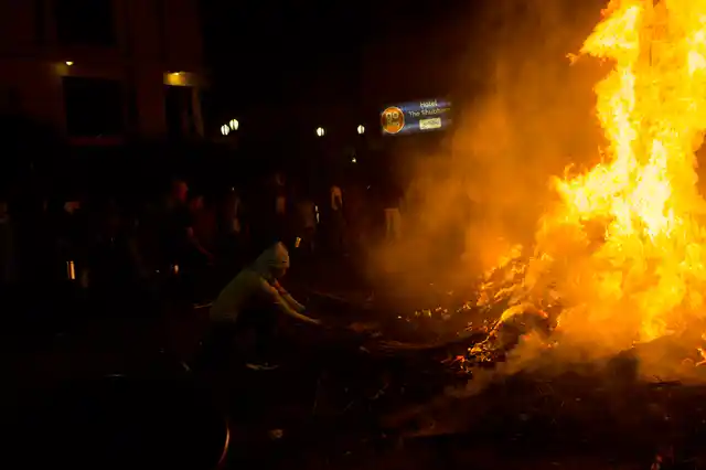 The Grand ‘Holika Dahan’ outside being performed outside the Banke Bihari temple. This is the largest fire in the town from where people carry the fires to their houses, a night before Holi.