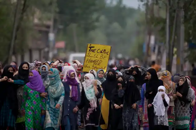 Kashmiri women participate in a protest against the rape of a 3-year-old girl from north Kashmir at Mirgund, outskirts of Srinagar.