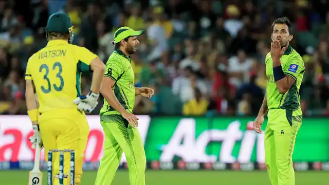 Pakistan’s Wahab Riaz blows a kiss to Australia’s Shane Watson, left, during their Cricket World Cup quarterfinal match in Adelaide, Australia, Friday, March 20, 2015. 