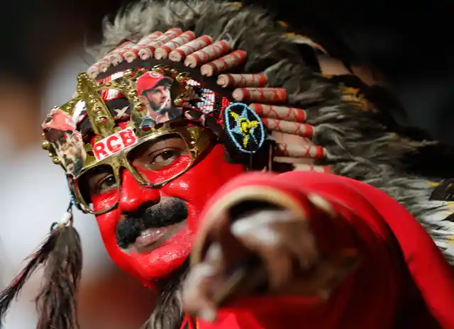A Royal Challengers Bangalore fan reacts to the camera before the start of the team’s IPL match against Sunrisers Hyderabad in Bangalore on 4 May. 