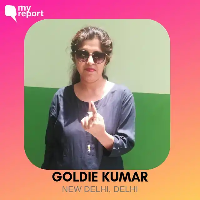 Goldie Kumar poses for a photo after voting.