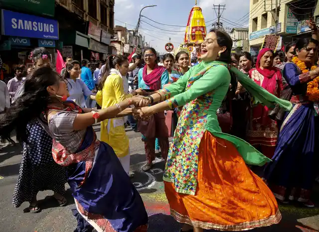 Devotees dance in celebration during Rath Yatra organised by ISKCON temple, in Jammu, Thursday, 2 May 2019. 