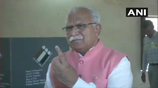 Haryana Chief Minister Manohar Lal Khattar casts his vote at a polling booth in Karnal.