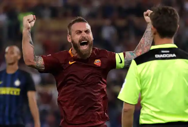 In this Oct. 2, 2016 file photo, Roma’s Daniele De Rossi celebrates after his teammate Kostas Manolas scored during a Serie A soccer match between Roma and Inter Milan.