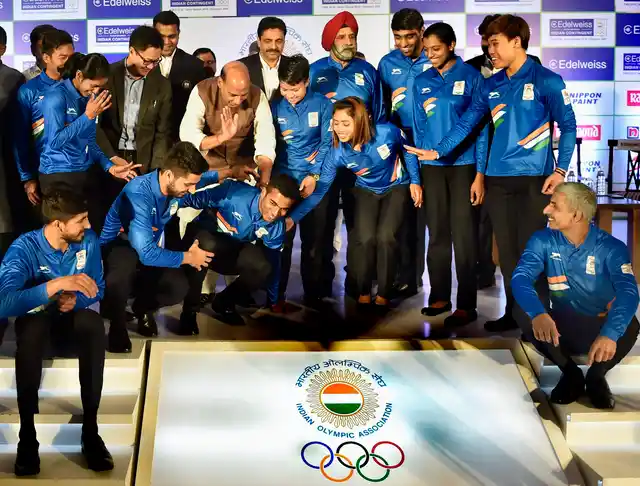 Rajnath Singh and Kiren Rijiju during a send-off ceremony for Indian athletes before the 2018 Commonwealth Games.