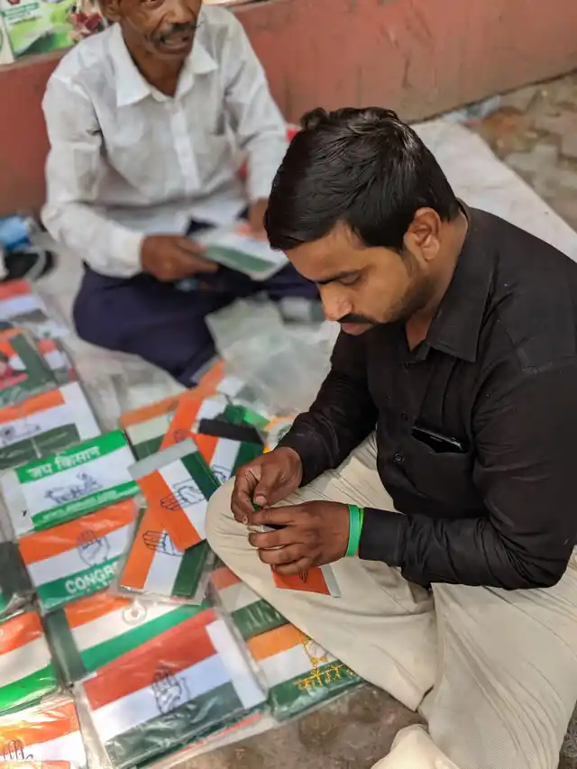 A shopkeeper packs up his merchandise by mid-day
