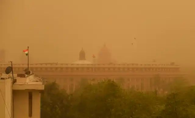 A view of the Parliament House during a dust storm in New Delhi on Wednesday, 12 June.