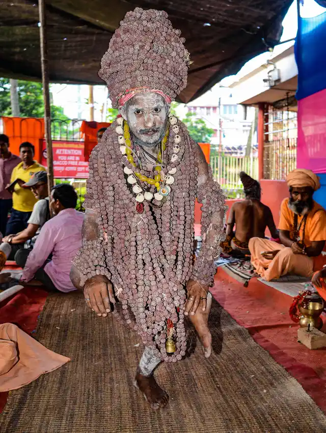 A Naga Sadhu wears rudraksh malas as he stands on one foot at Kamakhya temple on the occasion of annual Ambubachi festival, in Guwahati, on 22 June.
