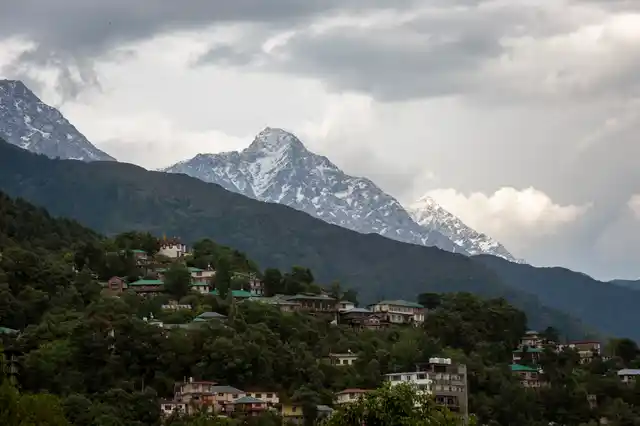 Fresh snow is seen on the Dhauladhar range of the Himalaya after rain and hail lashed the lower reaches in Dharmsala, India, Monday, 17 June 2019. 