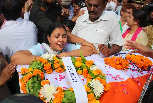 A family member breaks into tears near the body of Major Ketan Sharma after it was brought to his home in Meerut, Tuesday, 18 June 2019. Major Sharma was killed in an encounter with the militants in J&K’s Anantnag on Monday.