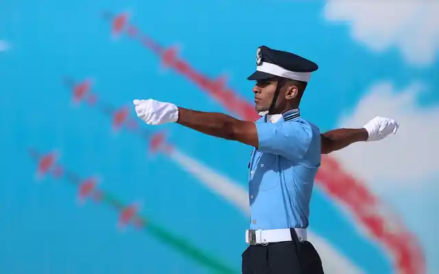 An Indian Air Force (IAF) cadet marches past a poster of an aircraft display during their graduation parade at the Air Force Academy in Dundigal, outskirts of Hyderabad, India, Saturday, 15 June 2019. 