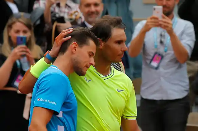 Spain’s Rafael Nadal, right, hugs Austria’s Dominic Thiem, left, after celebrating his record 12th French Open tennis tournament title after winning his men’s final match in four sets, 6-3, 5-7, 6-1, 6-1, at the Roland Garros stadium in Paris, Sunday, June 9, 2019. 
