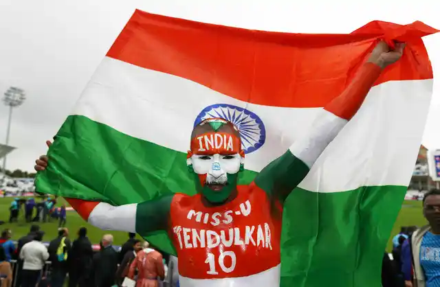 A fan of India arrives before the Cricket World Cup group stage match between India and New Zealand at Trent Bridge, Nottingham, England on Thursday, 13 June.