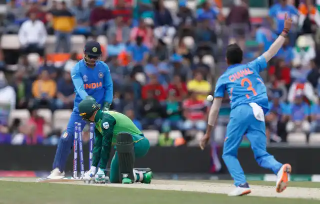 South Africa’s Rassie van der Dussen isclean bowled by India’s Yuzvendra Chahal during their Cricket World Cup match between South Africa and India.