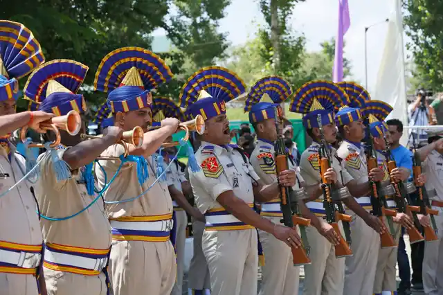 Indian paramilitary soldiers salute near the coffins of their colleagues who were killed by rebels, during a wreath-laying ceremony at their base camp on the outskirts of Srinagar, on Thursday, 13 June.