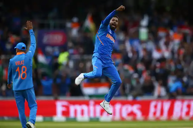 India's Hardik Pandya, right, celebrates taking the wicket of Pakistan's Shoaib Malik during the Cricket World Cup.