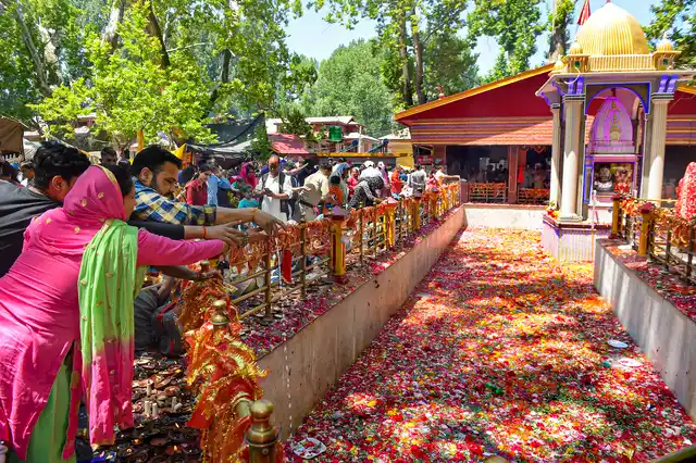 Kashmiri Pandits offer prayers during the yearly celebrations of Mela Kheer Bhawani at Kheer Bhawani Temple, Tullamulla, in Ganderbal District on Monday, 10 June. 