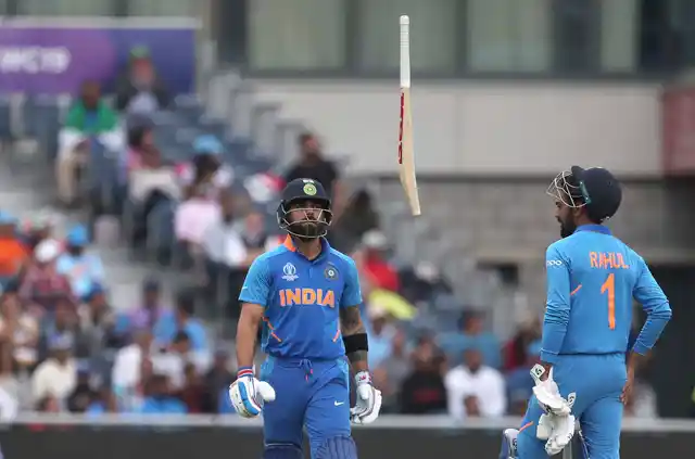 Skipper Virat Kohli tosses his bat in the air after being dismissed during their semifinal against New Zealand at the ICC World Cup 2019.
