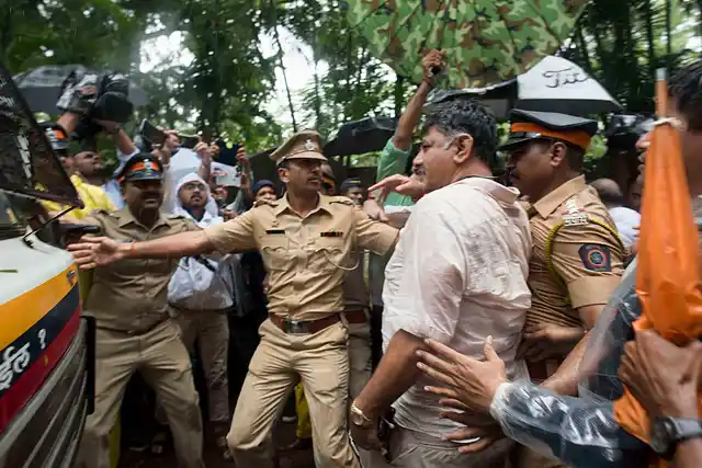Congress leader DK Shivakumar being detained by the Mumbai police for camping outside the Renaissance hotel, where the rebel MLAs were staying after submitting their resignation.