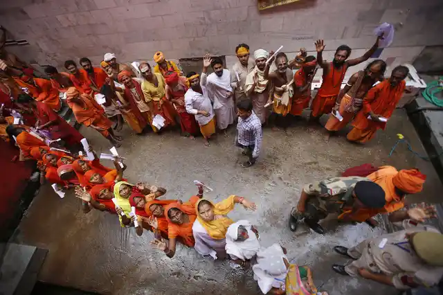 Devotees wait in queues to get themselves registered for Amarnath Yatra at a base camp in Jammu on Friday, 5 July.