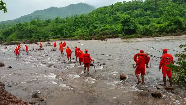 NDRF personnel conduct a search operation for missing villagers after the Tiware dam breach following incessant rains in Ratnagiri on Thursday, 4 July.