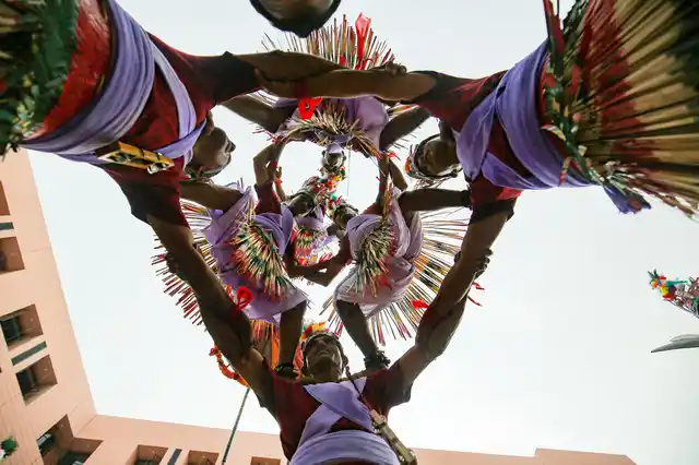 Devotees create a human pyramid as they perform a tribal dance on the eve of the annual Rath Yatra or chariot procession, in Ahmedabad on Wednesday, 3 July.