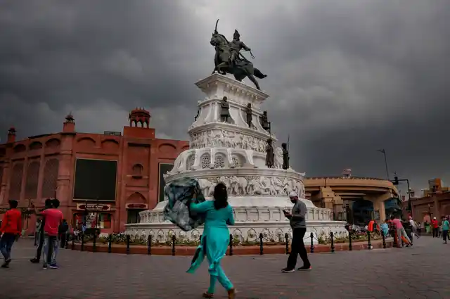 A statue of Maharaja Ranjit Singh in the backdrop of dense rain-clouds in Amritsar on Thursday, 4 July. 