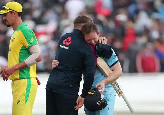 England’s captain Eoin Morgan, right, hugs teammate Jason Roy to celebrate their win over Australia in the Cricket World Cup semi-final match at Edgbaston in Birmingham, England, Thursday, July 11, 2019. 