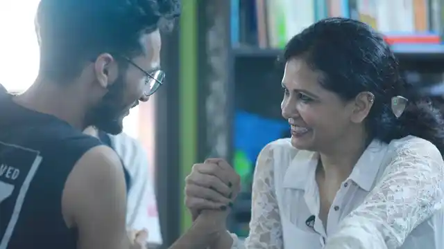 Dr Poonam Tariq arm-wrestling with her son Taha.