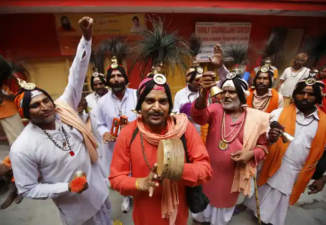 Sadhus chant religious slogans at Ram Mandir during the registration for annual Amarnath Yatra in Jammu on Friday, 5 July. 