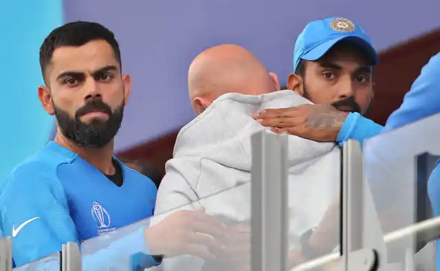 India’s captain Virat Kohli, left, and India’s K.L. Rahul, right, react after their loss in the Cricket World Cup semi-final match against New Zealand at Old Trafford in Manchester, England, Wednesday, July 10, 2019. 