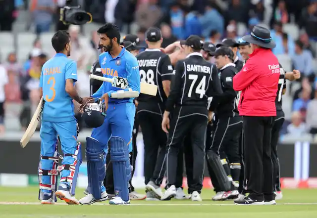 India’s Yuzvendra Chahal, left, and India’s Jasprit Bumrah react after their team lost the Cricket World Cup semifinal match between India and New Zealand at Old Trafford in Manchester, Wednesday, July 10, 2019. 
