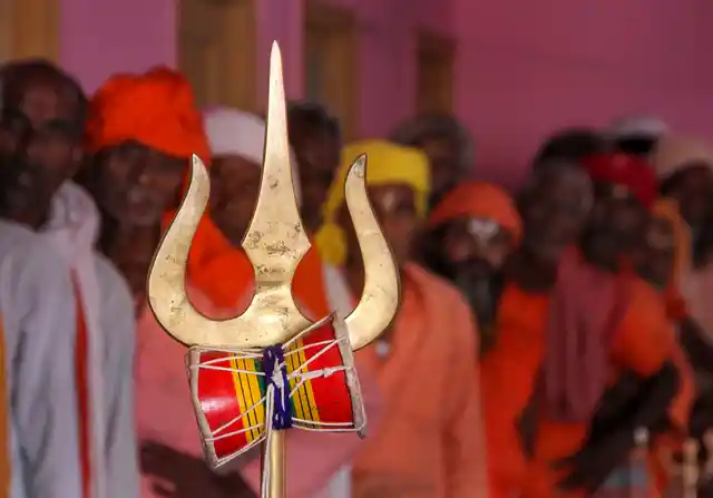 Sadhus wait in a queue to get themselves registered for the Amarnath Yatra 2019, at a base camp in Jammu.