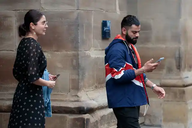 Virat Kohli and wife Anushka Sharma leave the team hotel in Manchester a day after the team got knocked out of the 2019 ICC World Cup.