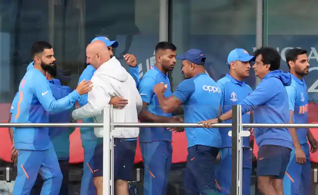 Indian cricketers greet each other after their team lost the Cricket World Cup semifinal match between India and New Zealand at Old Trafford in Manchester, Wednesday, July 10, 2019. 